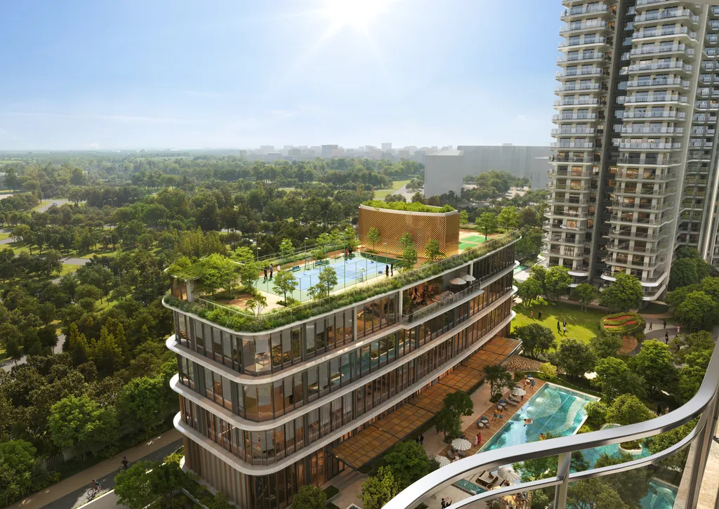 The three-level clubhouse seen from above, with a fenced sports court on its roof deck and a residential tower behind it, at Eldeco 7 Peaks Residences, Omicron 1A — builder render, artistic visualisation