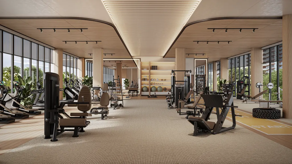 A gym floor of resistance machines and free weights under a curved timber ceiling, glazed on two sides onto greenery, at Eldeco 7 Peaks Residences, Omicron 1A — builder render, artistic visualisation